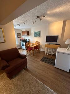 a living room with a couch and a table at Burns Lake Bed and Breakfast in Burns Lake
