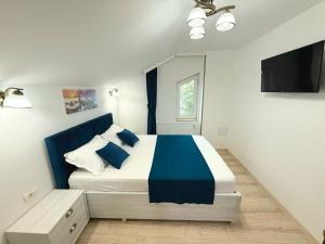 Postel nebo postele na pokoji v ubytování Vila Coty