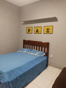 Ένα ή περισσότερα κρεβάτια σε δωμάτιο στο Casa de hospedagem