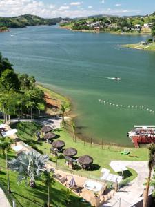a view of a body of water with a boat at Surreal Igaratá Pousada in Igaratá
