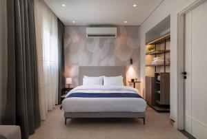 a bedroom with a large bed in a room at Special offer at 22 by spacey #54 Studio in Maadi in Cairo
