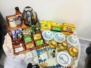 a table with a bunch of food and presents on it at Gadou Rooms -Private & Shared Stays in Port Said Best Location in Port Said