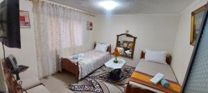 a small room with a bed and a mirror at Shkodra Stay in Shkodër
