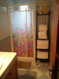 a bathroom with a shower with towels at Casa Rural MATEOS in El Puerto de Santa María
