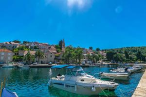 a group of boats are docked in a harbor at Apartment New in Splitska