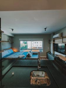 Televisyen dan/atau pusat hiburan di Quintal Moinhos by LikeHome