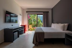 Postel nebo postele na pokoji v ubytování My Blue Hotel Holbox