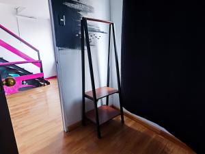 a mirror sitting in the corner of a room at Hotel Velero Express in Iquique
