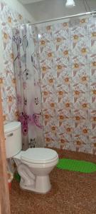 a bathroom with a toilet and a shower curtain at Diamante Andino in Copacabana +44 photos