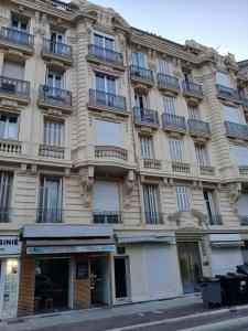a large building with balconies on a city street at Brand New Studio, Nice 06000, three hundred meters from the sea in Carre d'or in Nice