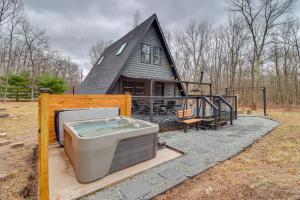 a house with a hot tub and a house at Hot Tub and Fire Pits Albrightsville A-Frame Cabin in Albrightsville