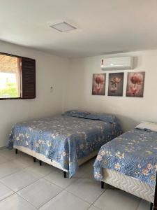 En eller flere senge i et værelse på Casa de Praia em Lucena Pb no condomínio