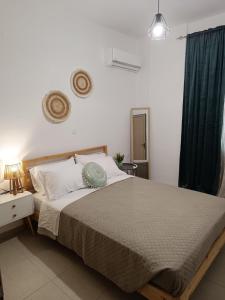 Postel nebo postele na pokoji v ubytování Tatti's Apartment