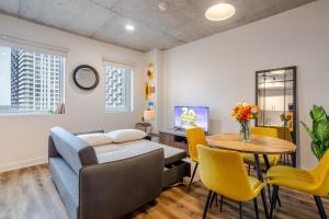 a living room with a couch and a table at Modern 1BR in downtown in Montréal +14 photos
