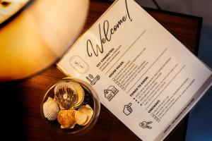 a invitation to a wedding with shells and a menu at Apartamento completo Ideal para descansar en familia en San Salvador in San Salvador