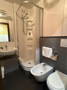 a bathroom with a sink and a toilet and a shower at Via Palazzo Sanremo in Sanremo