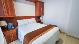 Postel nebo postele na pokoji v ubytování Retama Hotel Tacna