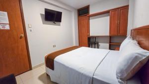 Postel nebo postele na pokoji v ubytování Retama Hotel Tacna