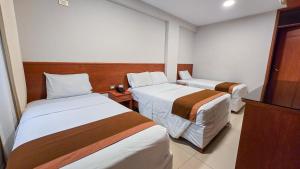 Postel nebo postele na pokoji v ubytování Retama Hotel Tacna