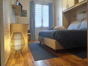 Postel nebo postele na pokoji v ubytování Valtellina-La casetta di Elena