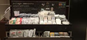 a store display with various products on a shelf at Richmond Hotel Tokyo Shiba in Tokyo