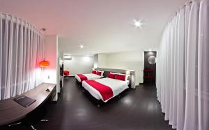 Posteľ alebo postele v izbe v ubytovaní Monterosa Apartamentos Amoblados