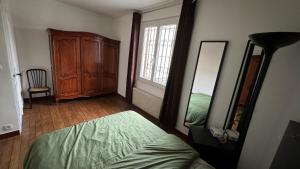 Postel nebo postele na pokoji v ubytování Maison d'hôte Augeard