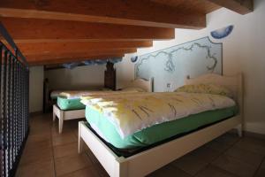 Postel nebo postele na pokoji v ubytování B&B I fiori di Marianna