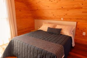 Postel nebo postele na pokoji v ubytování Cabana no Vale dos Vinhedos