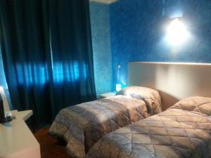 Letto o letti in una camera di Fenix