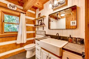 a bathroom with a sink and a toilet at Spacious Sebring Family Cabin with Fun Barn and Yard! in Sebring +31 photos