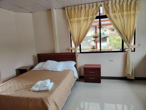 Postel nebo postele na pokoji v ubytování Casa y Flores