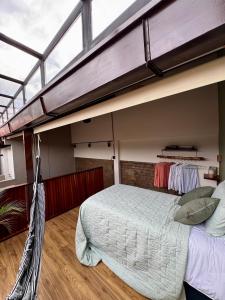 Ένα ή περισσότερα κρεβάτια σε δωμάτιο στο Casa de lujo con vista a Cristo Rey