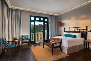 Voodi või voodid majutusasutuse Santarena Hotel at Las Catalinas toas