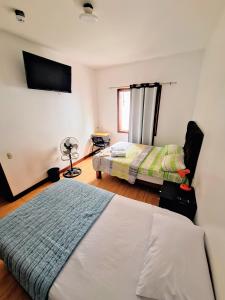 Postel nebo postele na pokoji v ubytování Casa Villa Descanso