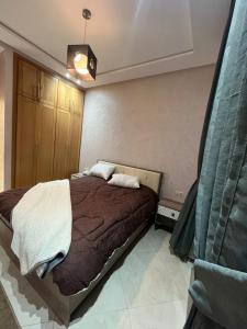 a bedroom with a large bed in a room at Villa iligh in Agadir