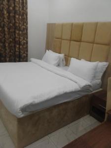 Posteľ alebo postele v izbe v ubytovaní Sogo Hotel And Suite