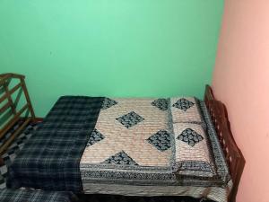 Postel nebo postele na pokoji v ubytování Holiday Guest in Nuwara Eliya