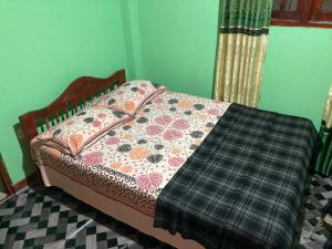 Postel nebo postele na pokoji v ubytování Holiday Guest in Nuwara Eliya