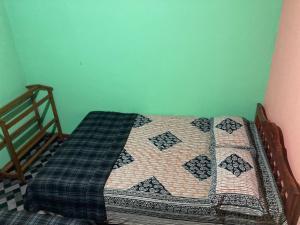 Postel nebo postele na pokoji v ubytování Holiday Guest in Nuwara Eliya