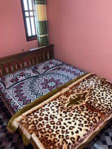 Postel nebo postele na pokoji v ubytování Holiday Guest in Nuwara Eliya