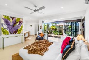 a living room with a leopard blanket on a couch at Belle Escapes Chillandos in Smithfield +85 photos