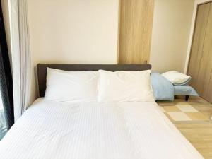 Postel nebo postele na pokoji v ubytování 颯House 3-4