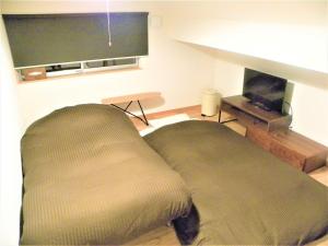 Televisyen dan/atau pusat hiburan di B&BHOUSE FAM - Vacation STAY 39533v +15 gambar