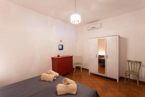 Postel nebo postele na pokoji v ubytování Casa Iolanda