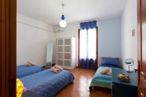 Postel nebo postele na pokoji v ubytování Casa Iolanda