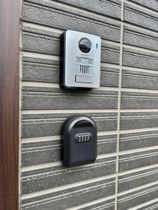 a wall with a security camera on it at HAOSTAY Villa Oishi Park in Fujikawaguchiko