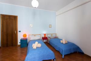 Postel nebo postele na pokoji v ubytování Casa Iolanda