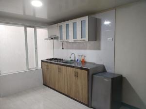 Kuchyň nebo kuchyňský kout v ubytování Apartamento Piso 3
