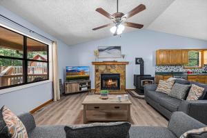 a living room with a couch and a fireplace at Red Rock Ranch in Cosby